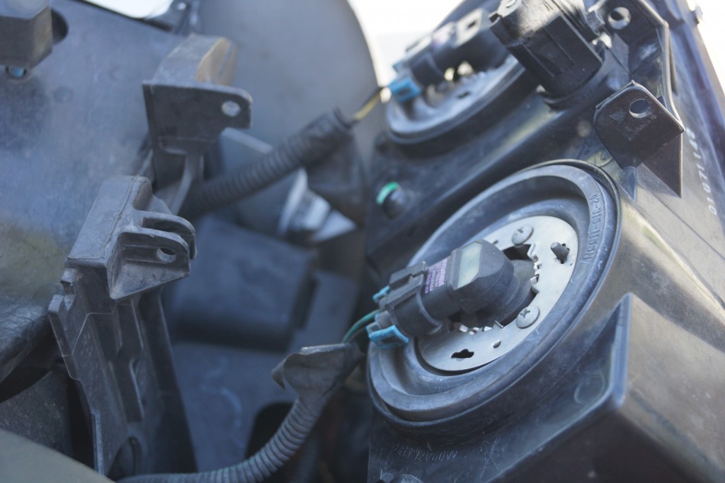 rear view of a late model truck headlight bulb mount