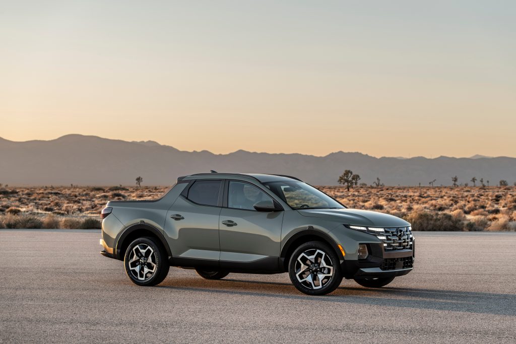 a hyundai santa cruz parked against a desert backdrop