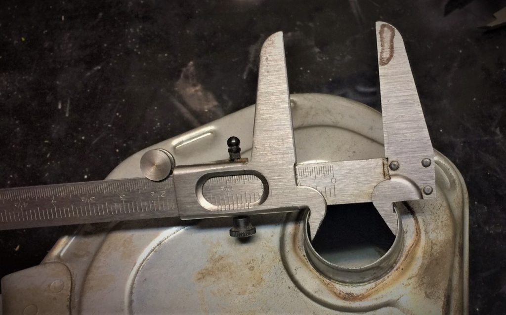 taking an inner inside diameter measurement with a measuring caliper for a 1970 honda cb 350 motorcycle air filter