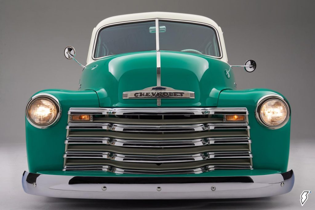 close up shot of the front grill of a custom 1952 chevy suburban carryall