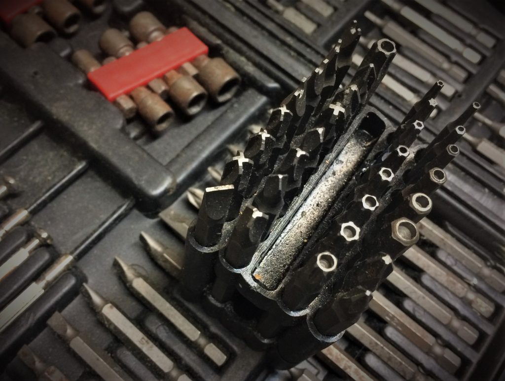 collection of security driver fastener bits in a case