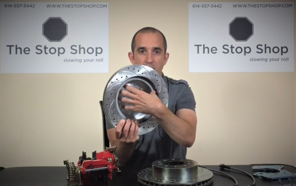 man holding disc brake components