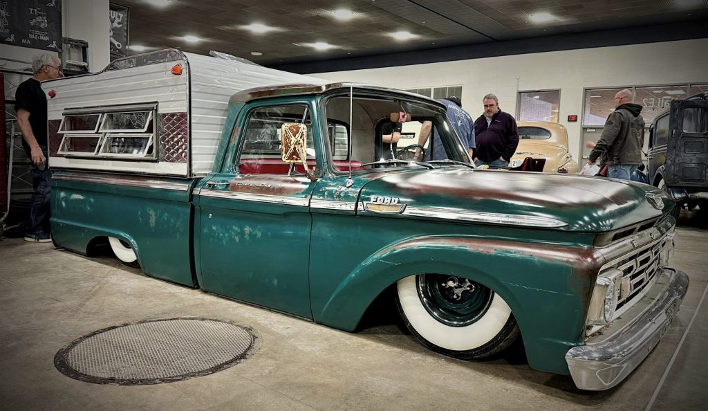 ford f100 lowrider pickup truck with custom vintage camper shell