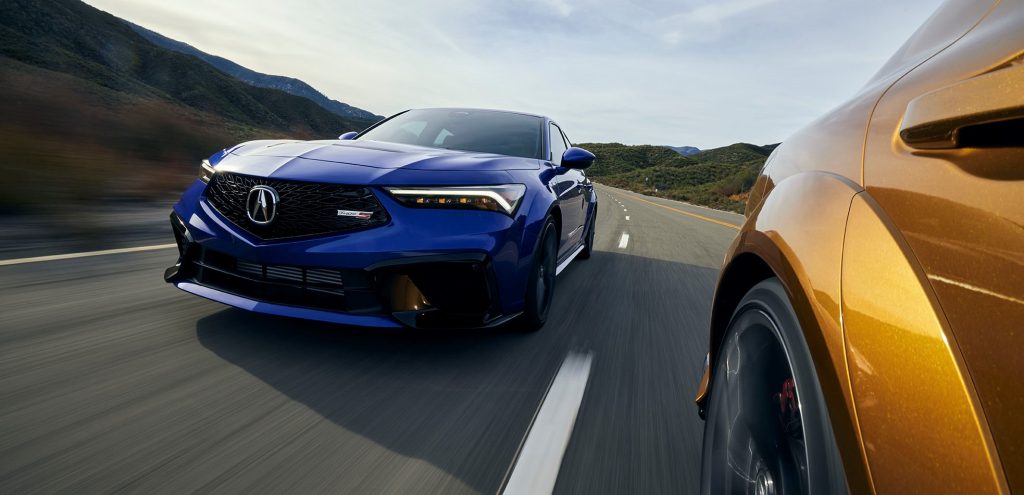front grille view of a blue 2024 Acura integra type s driving
