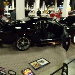 rear quarter shot of a black custom mustang coupe