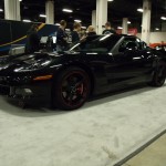 black c6 corvette coupe at indoor car show