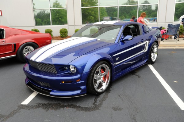 s197 ford mustang at a car show