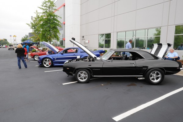 row of collector cars at a car show