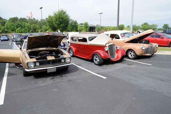 row of classic cars at a car show