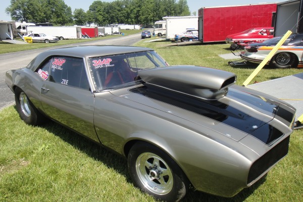 chevy first-gen camaro drag car with pro stock style hood