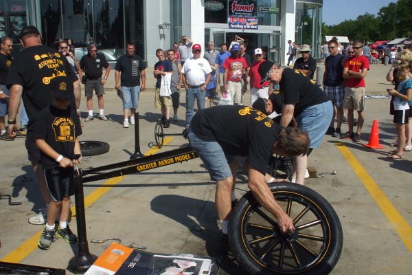 men assembling a ford model t demonstration, front end