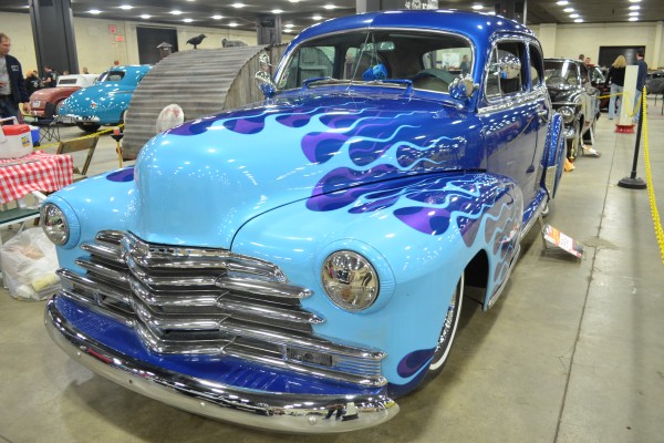blue flamed street rod at indoor car show