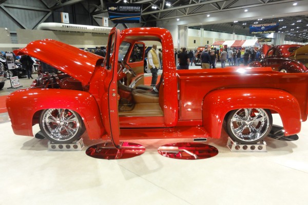 side view of a vintage truck at a car show