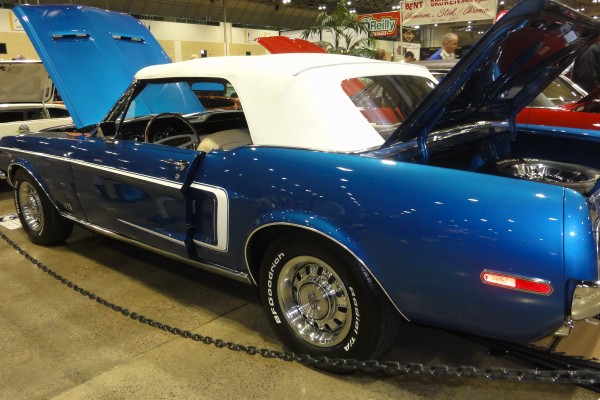 blue first gen ford mustang convertible