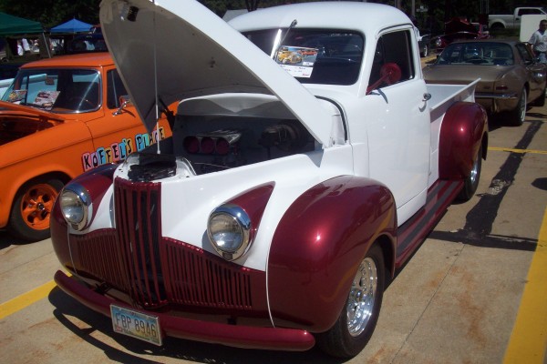 red and white studebaker custom pickup truck