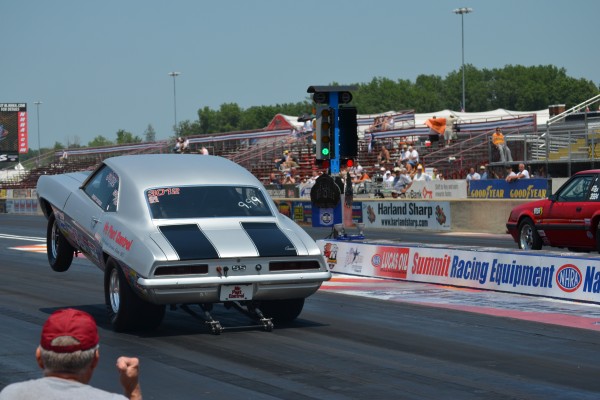 chevy camaro drag race doing a wheelstand at launch