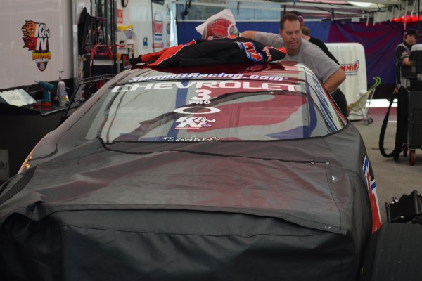 jason line with Summit Racing pro stock camaro in pits