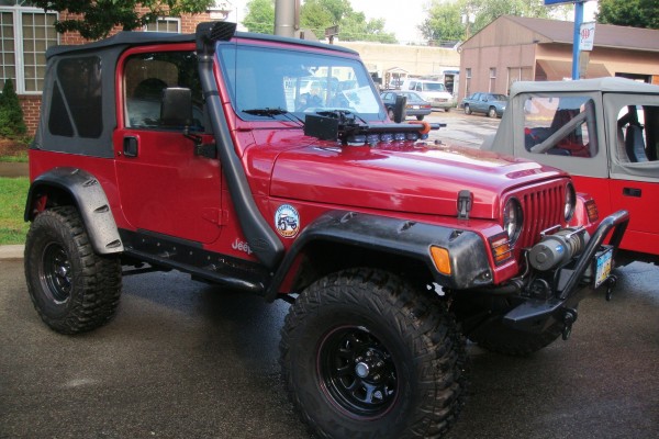 Red Jeep Wrangler tj with snorkel