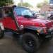 Red Jeep Wrangler with snorkel thumbnail