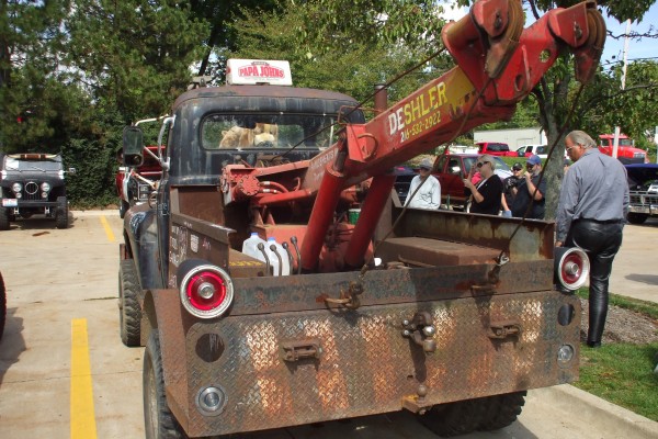rear view of a vintage ford tow truck boom wrecker