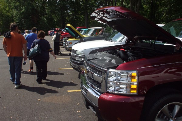 row of classic trucks at a show
