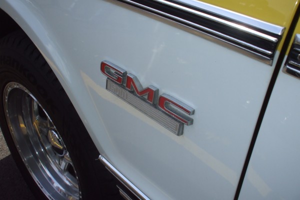 close up of gmc 1500 fender badge