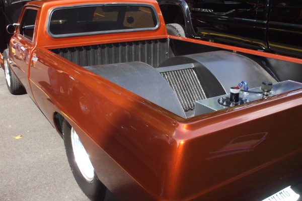 rear view of large wheel tubs on a drag race pickup truck