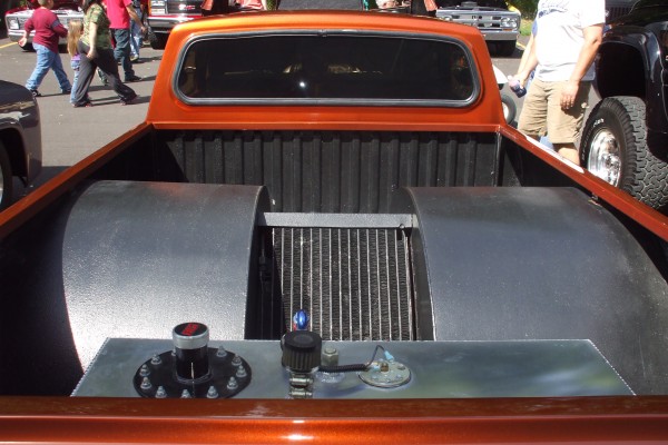 massive rear wheel tubs on a drag race pickup truck
