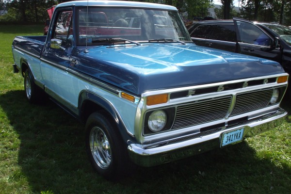 vintage ford pickup truck at a car show
