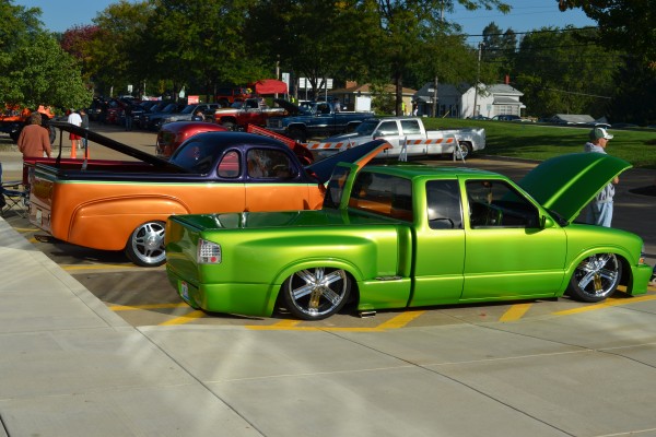 a pair of customized pickup trucks