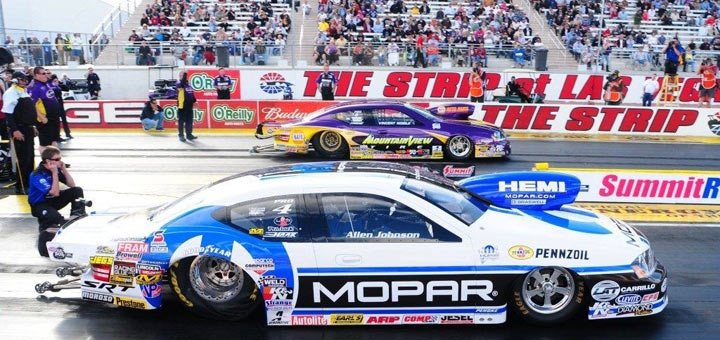 Allen Johnson launching at start of nhra funny car drag race