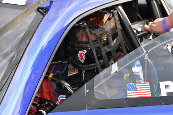 pete berner in cockpit of summit racing drag race camaro