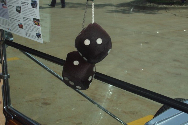 fuzzy dice in a hot rod