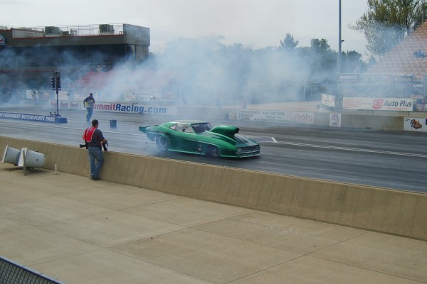 chevy camaro doing a burnout at dragstrip prior to race