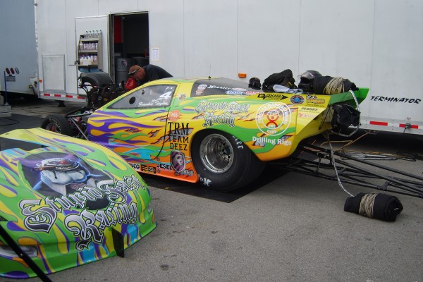 nhra funny car in pits during race