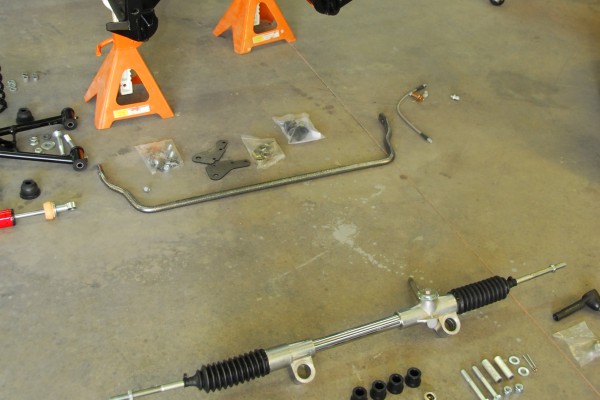 car parts resting on a concrete floor