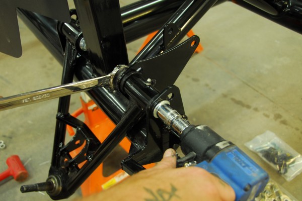 installing a control arm into a sports car chassis