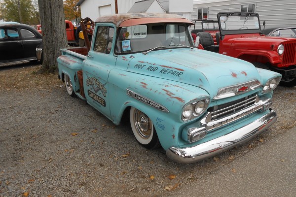 hot rod chevy pickup truck at a car show