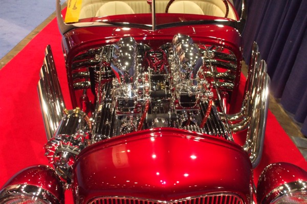 velocity stacks and chrome on a hot rod v8 engine