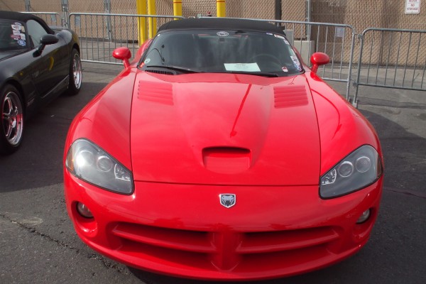 front of a dodge viper on display at 2012 SEMA show