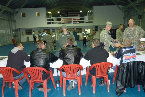 nhra drivers signing autographs for troops stationed overseas
