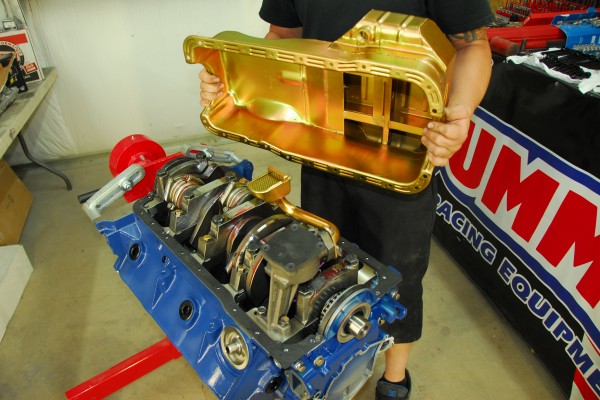 installing an oil pan on an engine in a stand