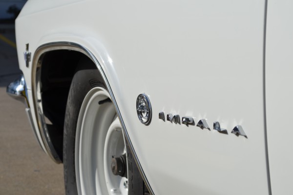running deer badge on a 1965 chevy impala fender