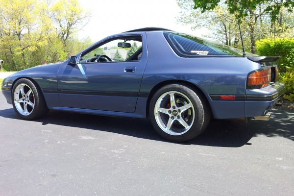 side view of a mazda RX-7 with sbc v8