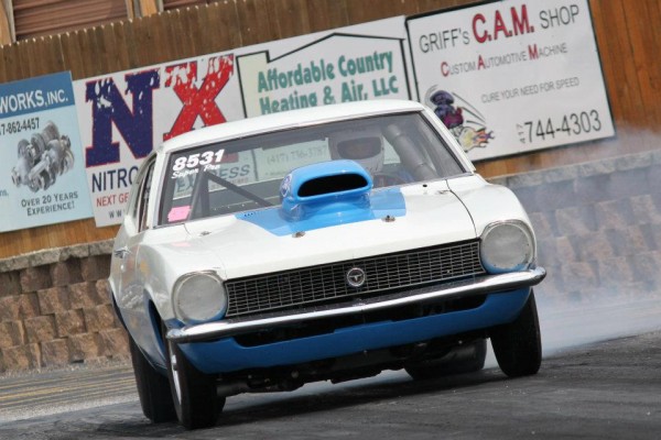 ford maverick drag car doing a burnout at the track