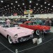 a pair of 1955 ford thunderbird coupes at a car show thumbnail