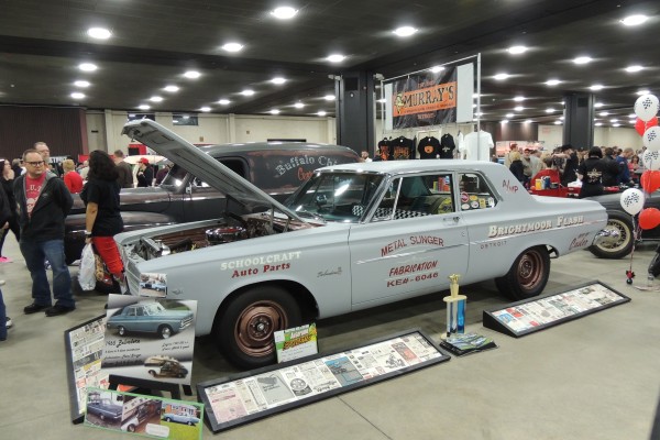 nostalgia plymouth drag car at a show