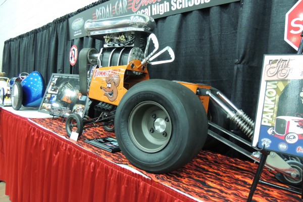 dragster rat fink pedal car on display at car show