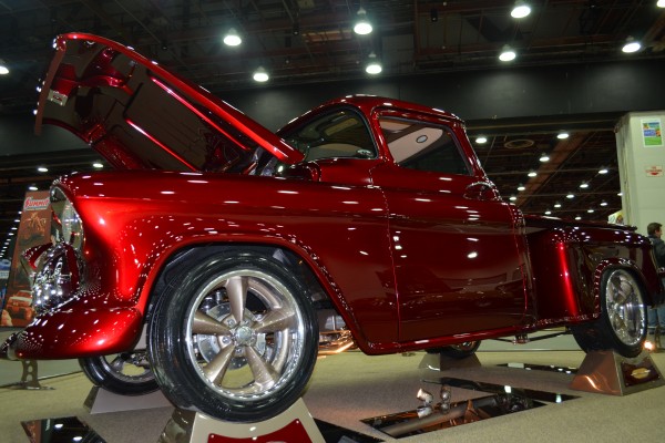 customized truck in a car show display