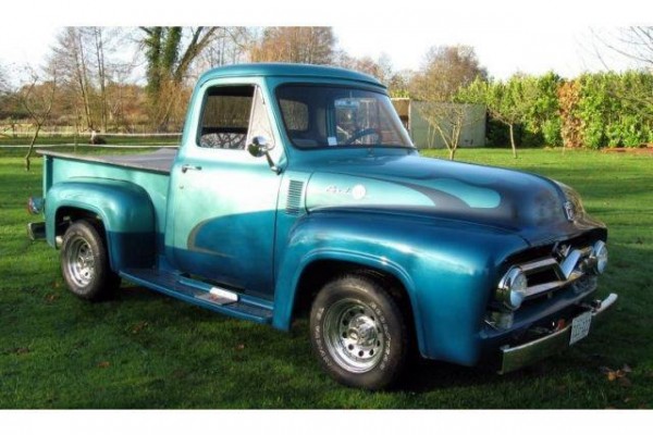 Vintage ford truck parked on grass